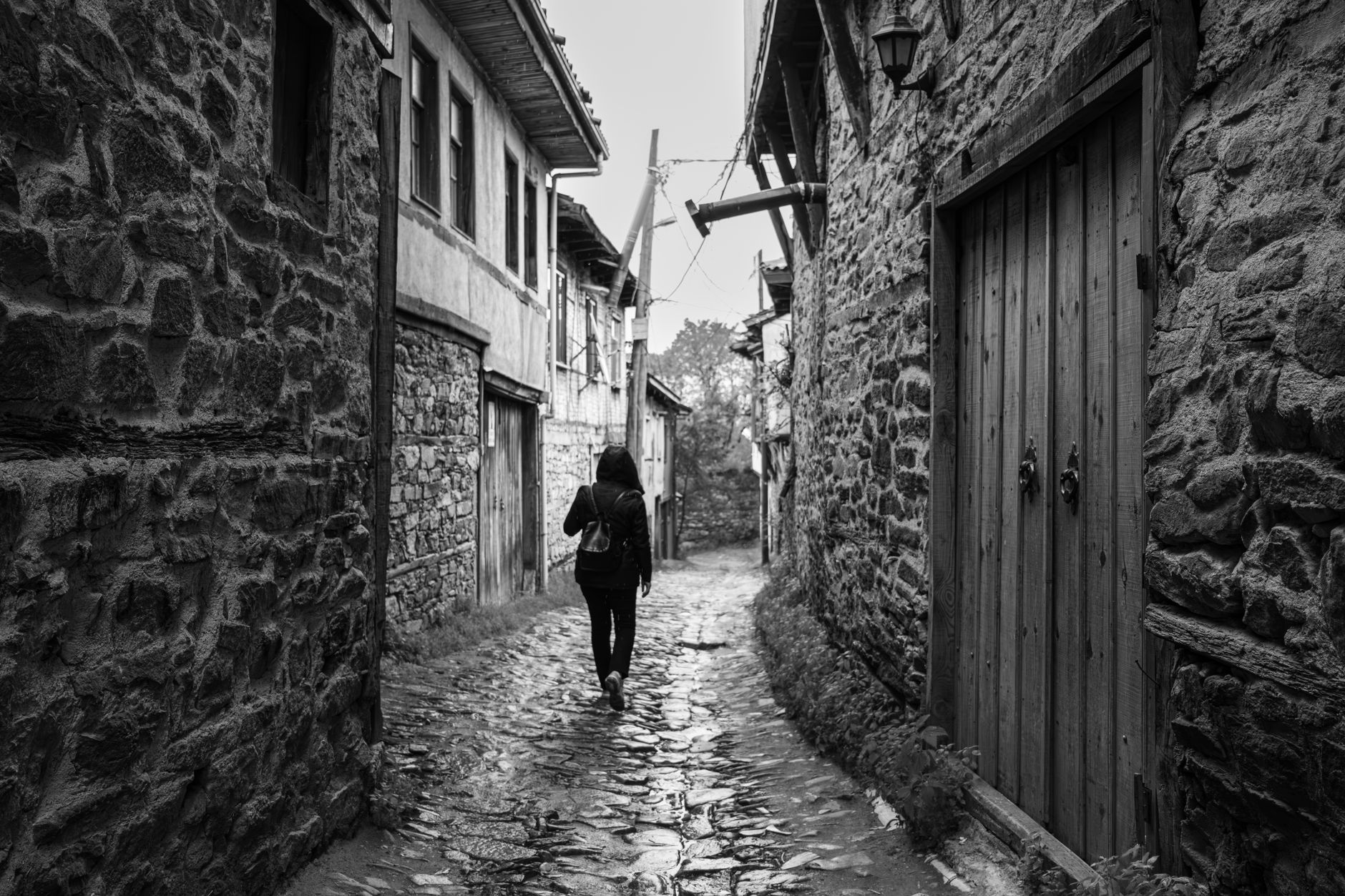 Author contemplating historic architectural alleyway