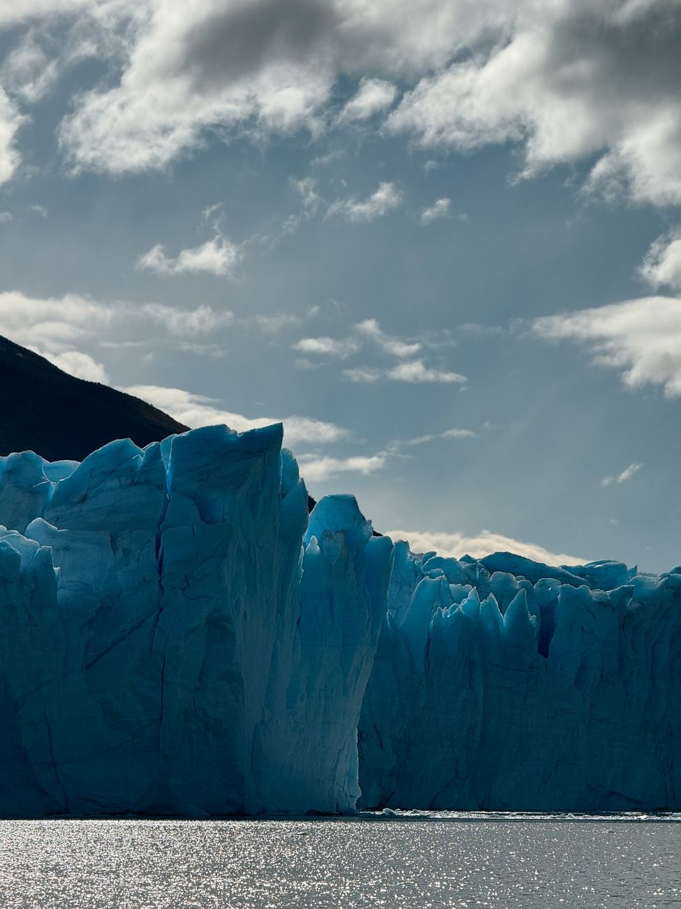 Patagonian mountain fjord with floating ice floes